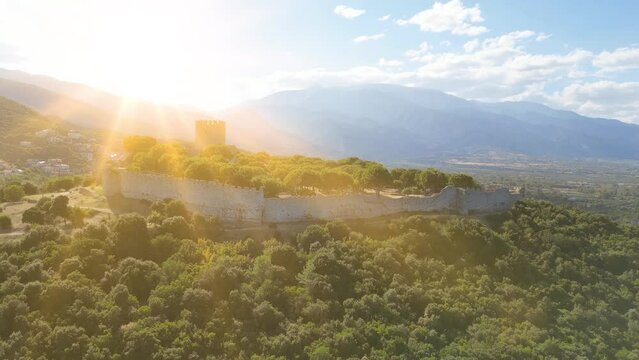 Aerial view of the Platamon Castle is a Crusader castle in Macedonia, Greece and is located southeast of Mount Olympus. Drone shot of Platamonas castle on Aegean Sea coast at sunset