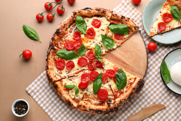 Board of tasty pizza Margarita with fresh tomatoes on brown wooden background
