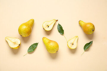 Ripe pears and leaves on yellow background - obrazy, fototapety, plakaty