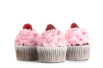 Tasty raspberry cupcakes on white background