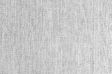 Fototapeta na wymiar Jacquard woven upholstery, white coarse fabric texture. Textile background, furniture textile material, wallpaper, backdrop. Cloth structure close up.