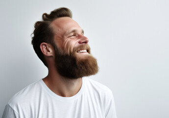 Fototapeta premium Man smiling with a beard, white background, happy, optimistic