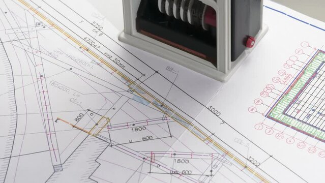 Design Drawing Approval. A stamp is placed on the design drawing and leaves an ink imprint symbolizing compliance with standards and building permission