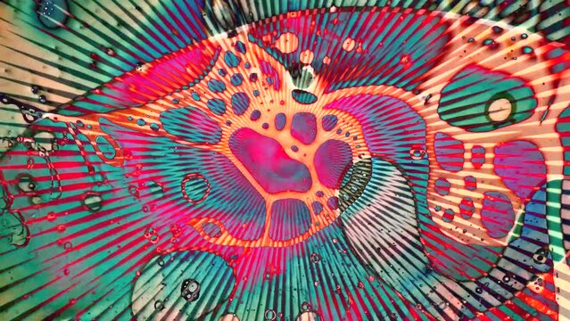 1970s psychedelic liquid projection with vibrant colours. Artistic dye pattern in ink and oil. Abstract artwork of cosmic visual reaction. 