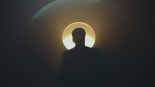 Mysterious man standing in front of a mysterious sphere. Glowing secret device. Sci-fi film. Science, nuclear power, nuclear fusion, mystery concept. Scientific experiment. Alien technology. 