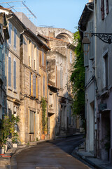 Fototapeta na wymiar View on old streets and houses in ancient french town Arles, touristic destination with Roman ruines, Bouches-du-Rhone, France