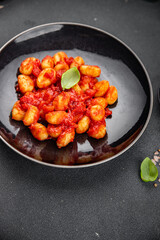 gnocchi delicious potato dish tomato sauce no meat ready meal appetizer meal food snack on the table copy space food background rustic top view vegetarian vegan food  
