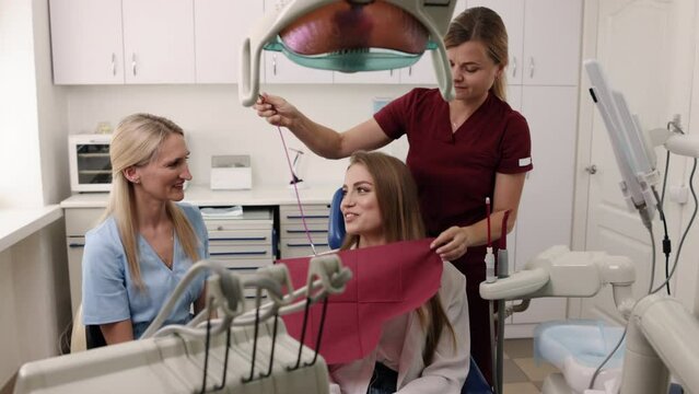 Procedure consultation, Dentist consultation, Consultation readiness. Engaging in dental consultation and preparing for impending treatment.