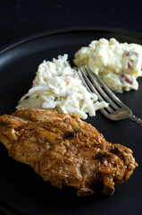 Macro Image of Porc Ribs with Coleslaw and Potatoe Salad