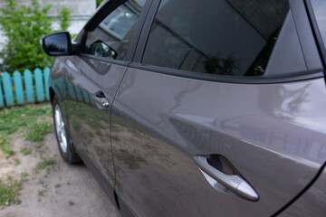 Fototapeta premium Car door handle on driver's door of modern car