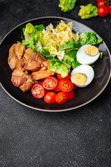 salad chicken liver, pasta, tomato, green leaf lettuce, boiled egg, farfalle snack meal food on the table copy space food background rustic top view