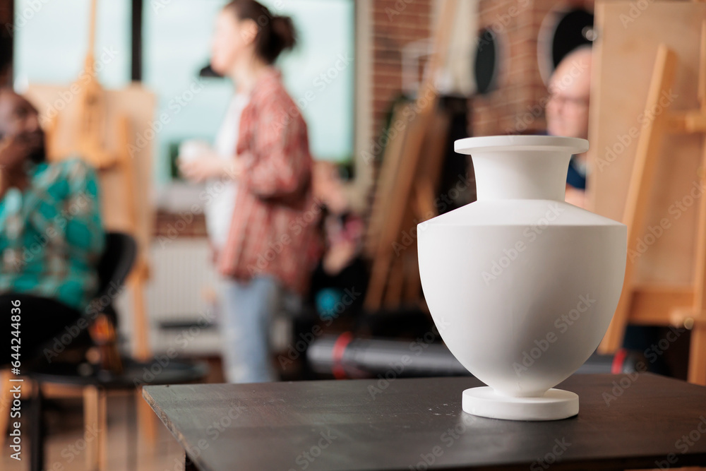 Poster still life drawing lessons. ceramic vase standing on table in art room classroom, group of people le