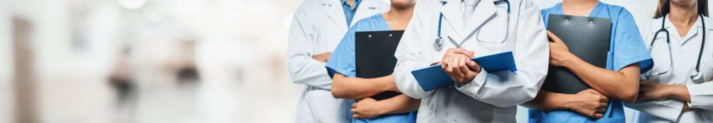 Confident medical staff team with doctor nurse and healthcare specialist professions people in...