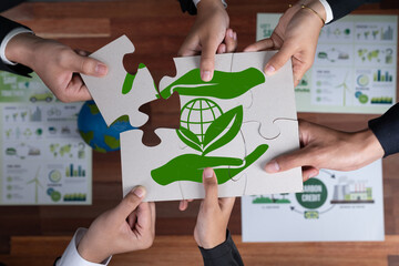 Top view cohesive group of business people forming jigsaw puzzle pieces in environmental awareness...