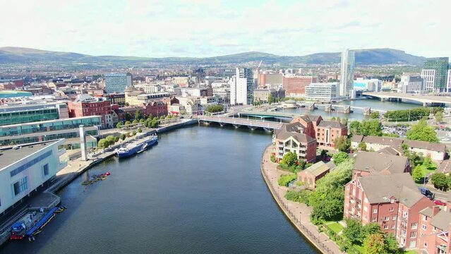 Aerial view on buildings and Lagan River in City center of Belfast Northern Ireland. Drone photo, high angle view of town