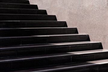 steps of an empty stone granite staircase close up