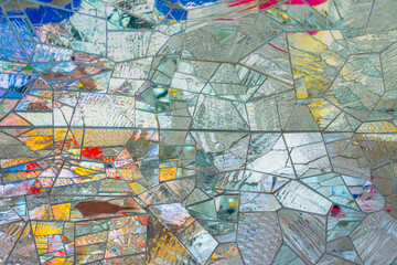 Obraz premium Abstract multicolored wall art glass crystals mosaic elements decoration. Detail of red, orange, white, silver glass color structure of ornamental abstract mosaic art patterns texture background.