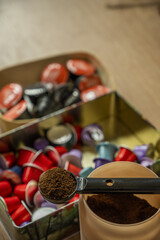 Still life with a container full of ground coffee