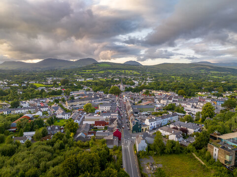 Aerial view of Kenmare with dramatic sunset sky popular vacation town in Southern Ireland at the entry point to the Ring of Kerry, three main streets for a triangle town center