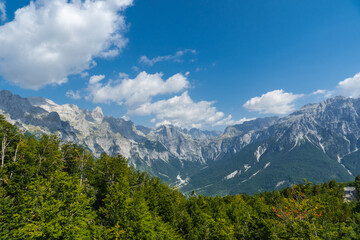 Fototapeta na wymiar Panoramic view of the valley peaks of Theth National Park, Albania. Albanian Alps