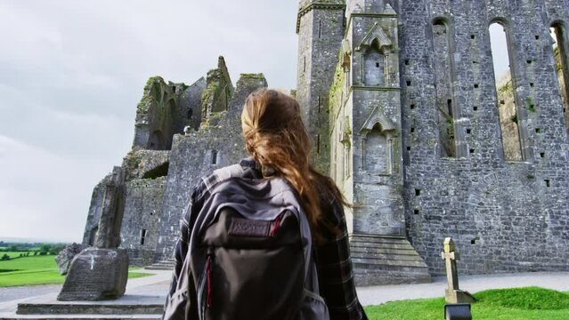 Woman In Rock of Cashel Ruins In Ireland - Slow Motion 