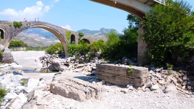 Aerial view of the Old Mes bridge near Shkoder from above. Albania, Europe. Ottoman stone arch bridge Ura e Kadiut