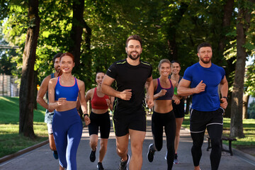 Group of people running in park. Active lifestyle