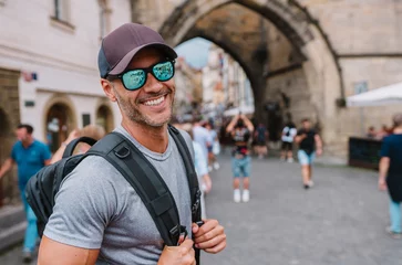 Crédence de cuisine en verre imprimé Prague Tourist man smiling having holiday trip.