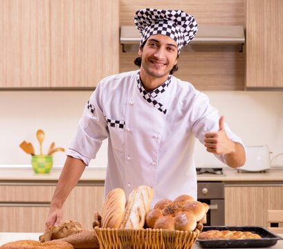 Young male baker working in kitchen