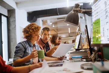 Young and diverse group of people working together in the office of a startup company