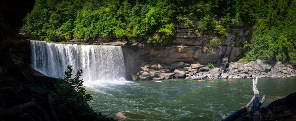 Panoramic view of Cumberland River waterfalls, with numerous paddle boats approaching the area...