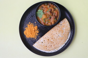 Set dosa served with black chana curry or sponge dosa, thick fluffy and soft made with rice, urad dal, fenugreek seeds and poha, south Indian food
