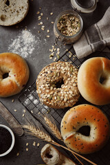 Whole wheat alkaline bread, donuts, oatmeal and grain decoration, healthy breakfast, wooden table background indoors