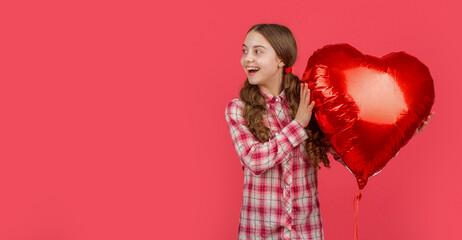 amazed girl hold love heart balloon on red background