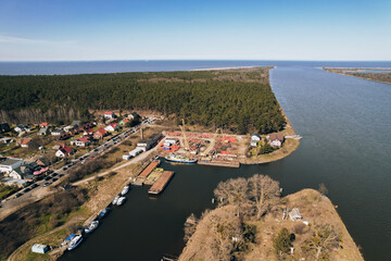 Fototapeta na wymiar Yacht marina in harbour Sobieszewo Island. Aerial Drone view of the green district of Gdansk located on the Vistula River in spring. 