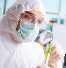 Male biotechnology scientist chemist working in the lab