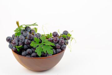 Purple grape Kyoho Grape with leaves on white background