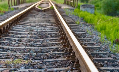 Fototapeta premium Railway tracks and rails in the countryside at sunset