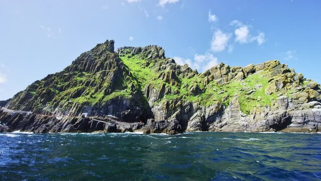 Skellig Michael island approaching with waves crashing