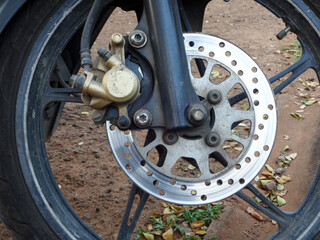 The front wheel motorcycle disc brake system provides for the brakes to stop at speed.