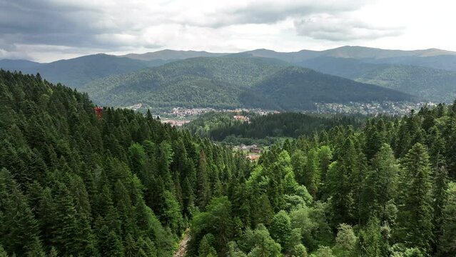 Aerial footage of mountains and Brasov, Romania