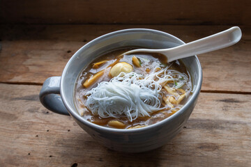 Cloes up photo of fish maw in a bowl on wooden table.