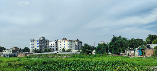 landscape with trees and clouds sky city 