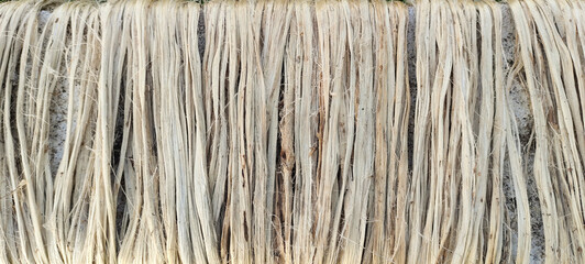 a close up photo of jute fiber Closeup shot, raw jute fiber hanging under the sun for natural drying