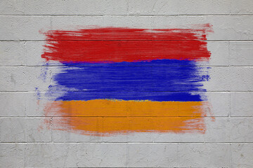 Armenian flag colors painted on brick wall