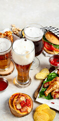 A selection of beer and snacks. Light beer, dark beer, live beer.