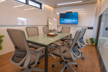 Modern conference room with furniture, laptops, Coworking meeting room.