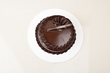 Top view of chocolate cake on white background