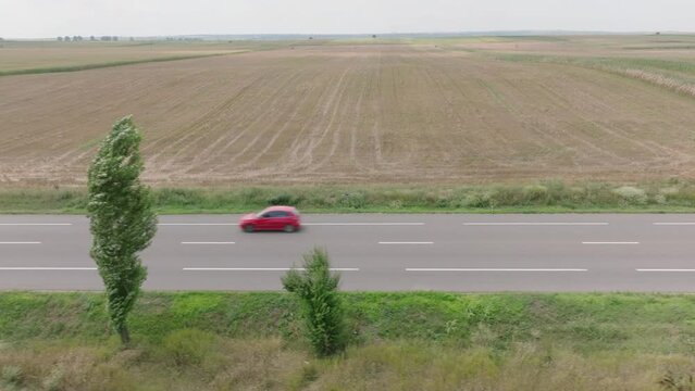 Vehicles Driving On European Route 85 (E85) In Domnesti-Targ, Romania. aerial sideways