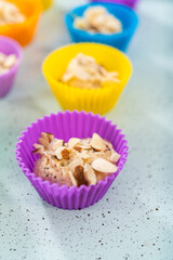 Lemon poppy seed muffins garnished with almond slivers